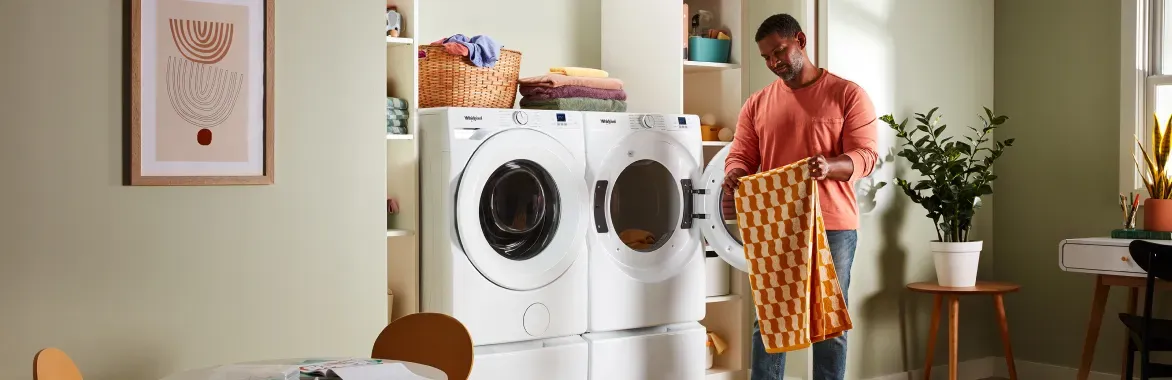 whirlpool-front-load-laundry-man-doing-laundry-hero